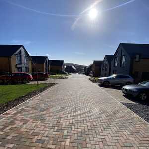 Family stand outside commercial building completed by N&G Groundworks